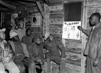 Staff Sergeant Herbert Ellison explains the GI Bill to fellow soldiers